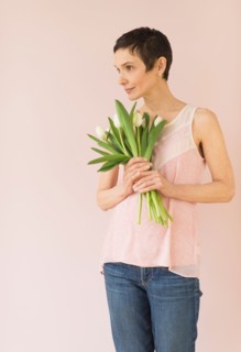 Portrait of mature woman with tulips.