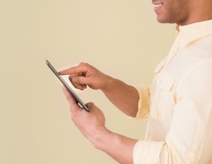 Young man using digital tablet.