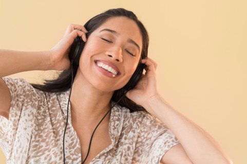 Young woman listening to music.