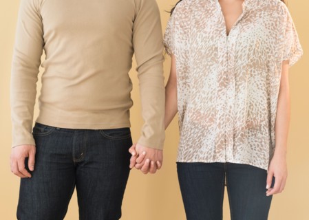 Young couple holding hands.
