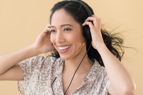 Portrait of young woman in headphones.