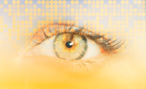 Close-up of female eye with digital pattern.