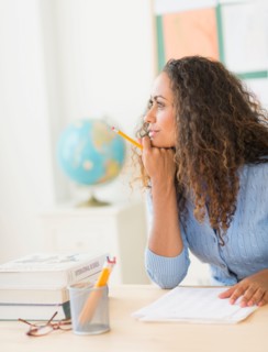 Portrait of elementary school teacher in class.