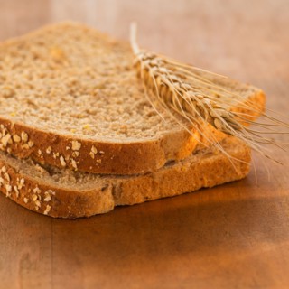 Studio Shot of slices of bread with wheat