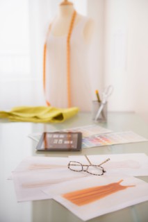View of digital tablet, sketch and spectacles