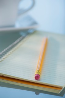 Studio Shot spiral-bound notebook and pencil