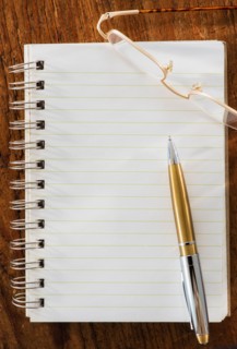 Studio Shot spiral-bound notebook and pen