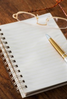Studio Shot spiral-bound notebook and pen