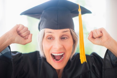Portrait of woman in graduation cap