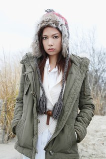 Portrait of young woman in warm clothes