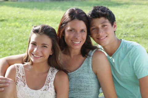 Portrait of mother with daughter (12-13) and son (14-15)