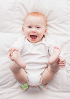 Directly above portrait of baby boy (18-23 months) lying down