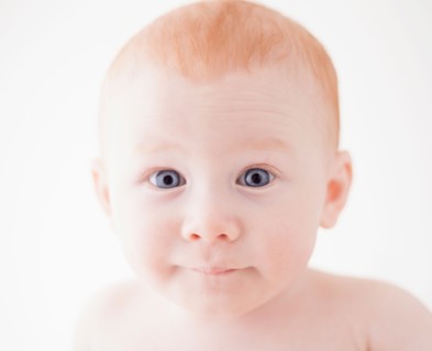 Studio shot portrait of surprised baby boy (18-23 months)
