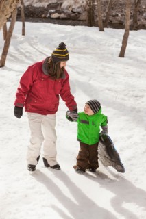 Portrait of young woman with boy (4-5) during stroll
