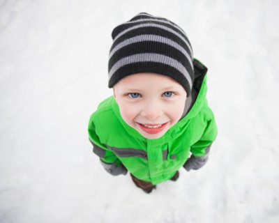 Directly above portrait of standing boy (4-5) looking up