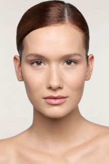 Studio shot portrait of young woman