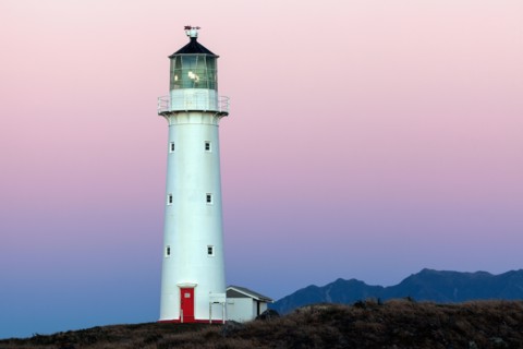 Lighthouse with Taranaki volcano in background