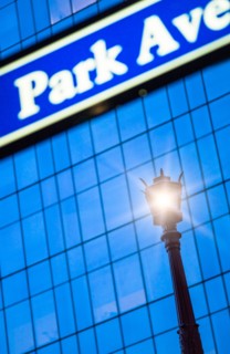 Detail of Park Avenue sign with street lamp. New York City, New York.