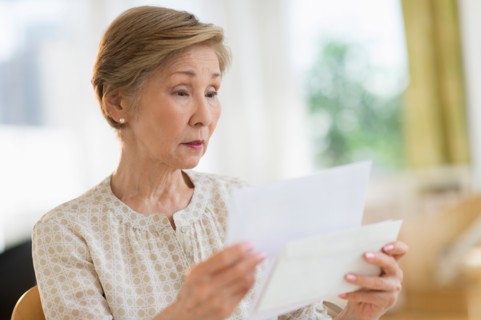 Senior woman reading letter.