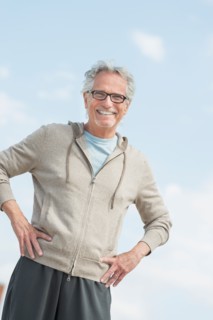 Portrait of senior man standing outdoors.