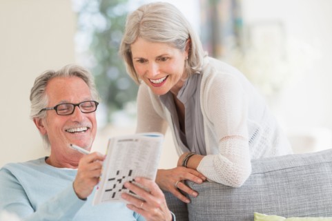 Senior couple doing crossword.
