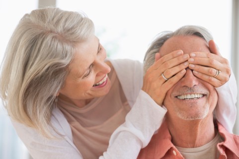 Playful senior couple.