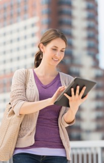 Young female using digital tablet.