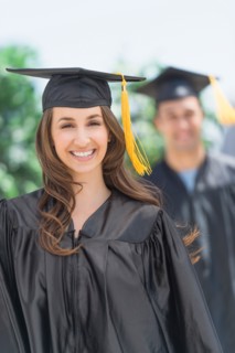 Female and male student on graduation ceremony.