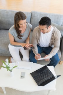 Young couple doing home finances.
