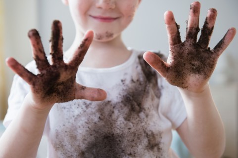 Boy (4-5) showing dirty hands