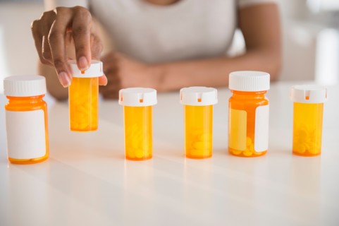 Woman's hand holding medicine