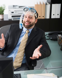 Portrait of businessman dreaming about vacation