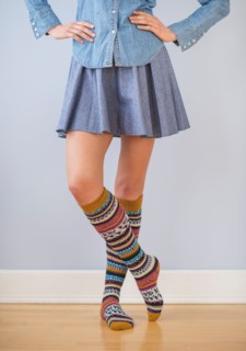 Studio Shot of woman wearing skirt and striped kneesocks