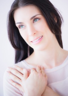 Portrait of smiling woman with arms crossed