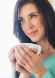 Woman with cup in hand