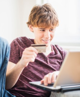 Teenage boy (14-15) shopping online