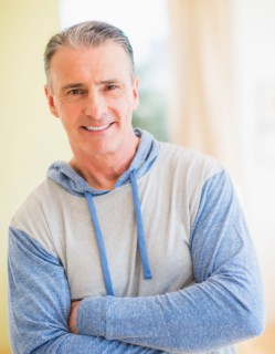 Portrait of man with arms crossed