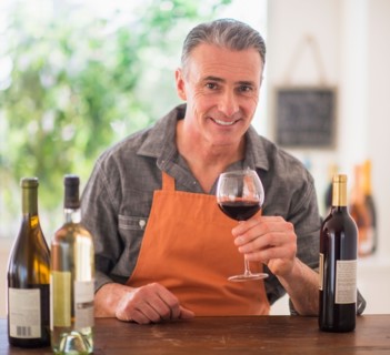 Portrait of man tasting wine