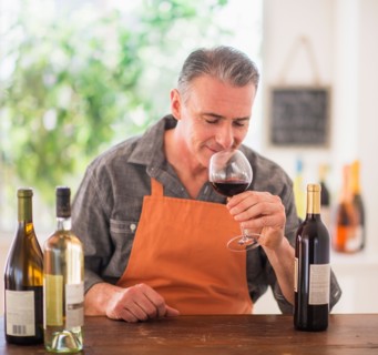 Portrait of man tasting wine