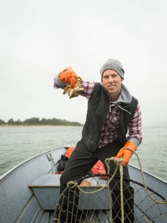 Portrait of man showing crab