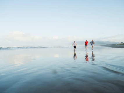 Men running on beach