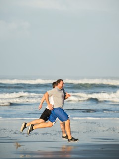 Men running on beach