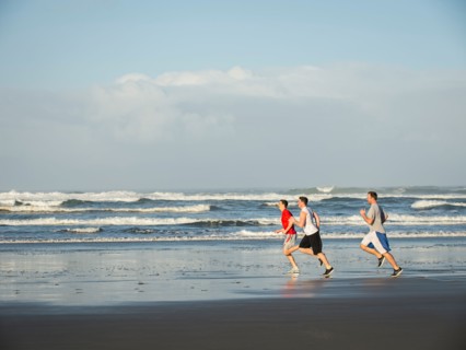 Men running on beach