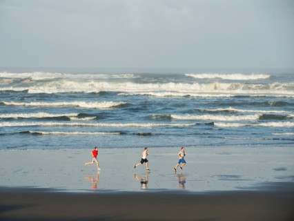 Men running on beach