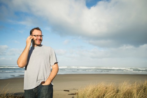 Mid adult man taking photograph