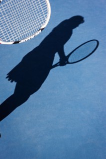 Shadow of female tennis player