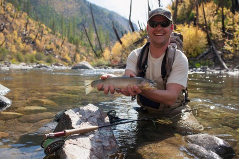 Fisherman showing fresh trout