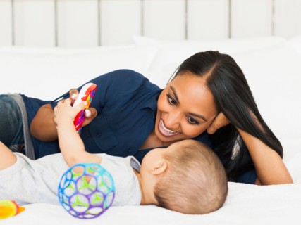Mother playing with her son (2-5 months)