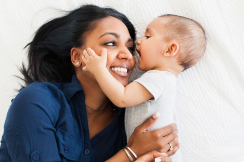 Mother hugging her son (2-5 months)