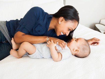 Mother playing with her son (2-5 months)